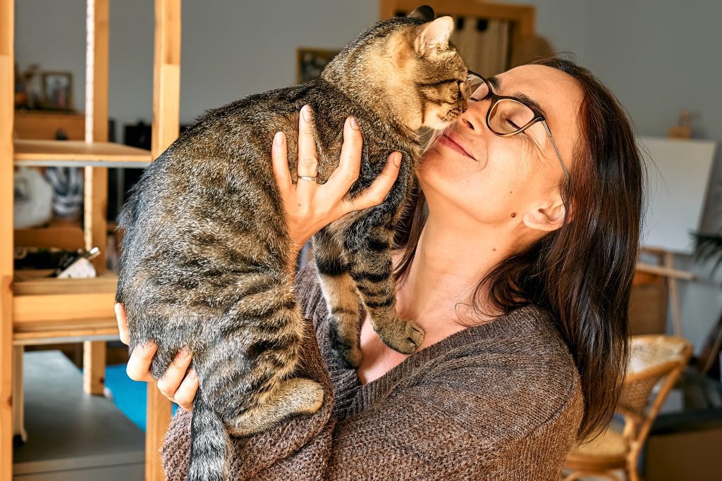 woman holding a cat